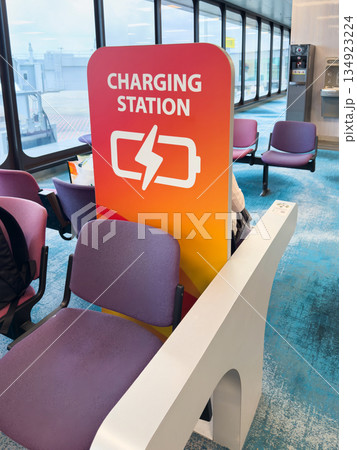 Charging station at singapore airport for travelers requiring battery recharge 134923224
