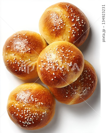 Freshly baked Kaiser rolls with sesame seeds, isolated on a white background 134923231