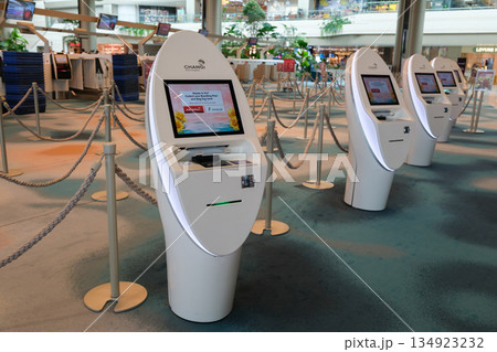 Changi Airport self-service kiosks with modern design in Singapore's terminal area 134923232