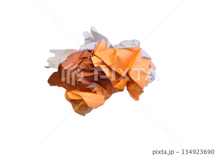 A wad of crumpled colored paper. 134923690