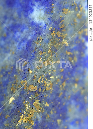 Close up of lapis lazuli blue and gold crystal gemstone harmony background Close up of lapis lazuli blue and gold crystal gemstone harmony background 134923835