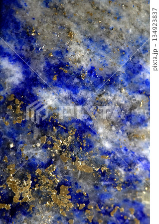 Close up of lapis lazuli blue and gold crystal gemstone harmony background Close up of lapis lazuli blue and gold crystal gemstone harmony background 134923837