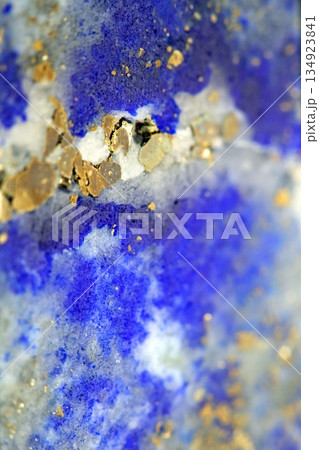 Close up of lapis lazuli blue and gold crystal gemstone harmony background 134923841