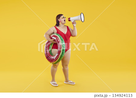 Funny fat woman screaming with mouthpiece on studio yellow background wearing red swimsuit. Funny fat woman screaming with mouthpiece on studio yellow background wearing red swimsuit. 134924113