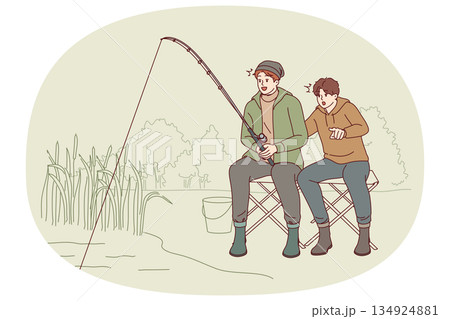 Son and father are fishing in lake, mouths open in anticipation of big catch at sight of fish 134924881