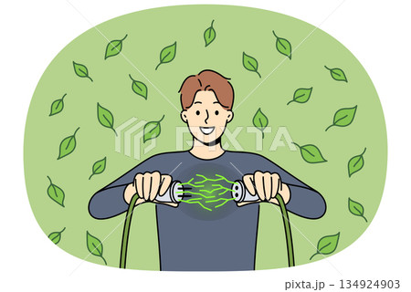 Man uses green energy obtained from environmentally friendly sources and connects two wires 134924903