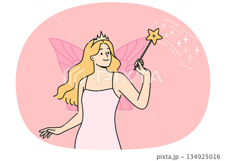 Fairy woman with wings behind back and magic wand performs magic, dressed in dress and crown Fairy woman with wings behind back and magic wand performs magic, dressed in dress and crown 134925016