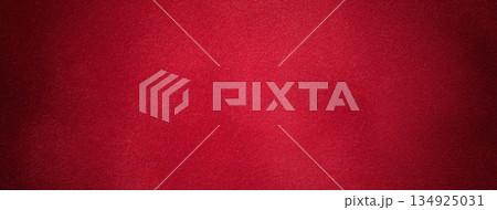 Dark red suede fabric background with matte velvet texture, wine tones and soft felt surface with vignette in macro 134925031