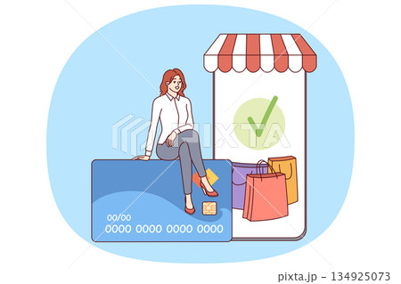 Phone for mobile shopping and woman shopper sitting on credit card to pay for online purchases Phone for mobile shopping and woman shopper sitting on credit card to pay for online purchases 134925073