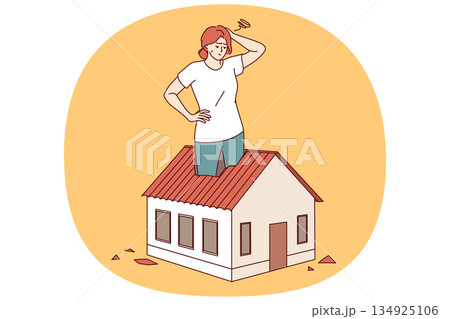 Woman homeowner suffers from small area of house, stands in miniature cottage and scratches head Woman homeowner suffers from small area of house, stands in miniature cottage and scratches head 134925106