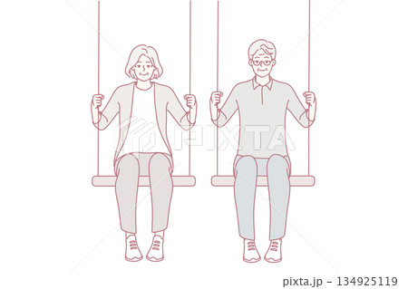 Energetic old couple sit on swings Energetic old couple sit on swings 134925119
