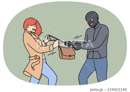 Masked robber takes bag from frightened woman who screams for help from police or passers-by 134925140
