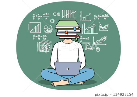 School student boy uses laptop sitting on floor, with laptop on lap and books instead of head 134925154