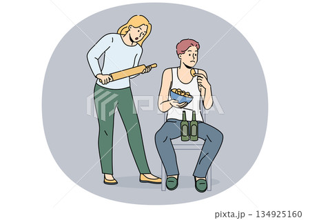 Woman quarrels with slacker husband, who drinks beer and eats chips and does not want to go to job Woman quarrels with slacker husband, who drinks beer and eats chips and does not want to go to job 134925160