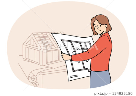 Woman architect creates engineering plans and models of houses, working in construction office Woman architect creates engineering plans and models of houses, working in construction office 134925180