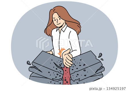 Strong business woman breaks stones with palm, demonstrating seriousness in achieving success Strong business woman breaks stones with palm, demonstrating seriousness in achieving success 134925197