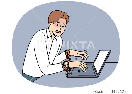 Business man has fallen into slavery from work, and suffers, standing near laptop with hands tied 134925253