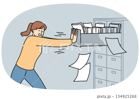 Woman closes overflowing filing cabinet, suffering from overabundance of paperwork and bureaucracy 134925268