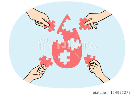 Drop of blood from puzzles in hands, as metaphor for donation and fight against cancer Drop of blood from puzzles in hands, as metaphor for donation and fight against cancer 134925272