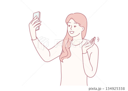 Cheerful portrait selfie, Energetic woman happily posing for selfie with friendly wave and sincere smile Cheerful portrait selfie, Energetic woman happily posing for selfie with friendly wave and sincere smile 134925338