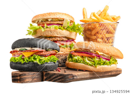 Assorted burgers with french fries on wooden board isolated on white background 134925594