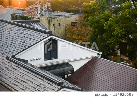 The rooftop of Japanese house, traditional Japanese house rooftop. Tile roof in Japan. Building exterior. Travel concept. 134926598