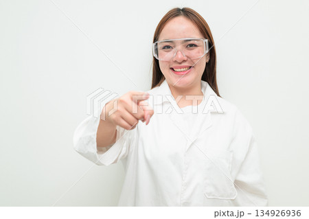 Portrait of Asian female research scientist against white background pointing finger 134926936