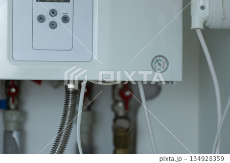 Heating gas boiler control panel with buttons. Symbolic image of the heating season at home. 134928359