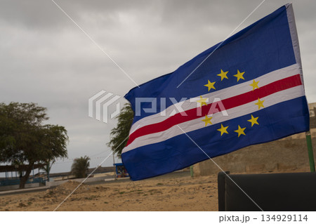 Cape Verde flag flutters in the wind in the Sal Rei city at overcast day Cape Verde flag flutters in the wind in the Sal Rei city at overcast day 134929114