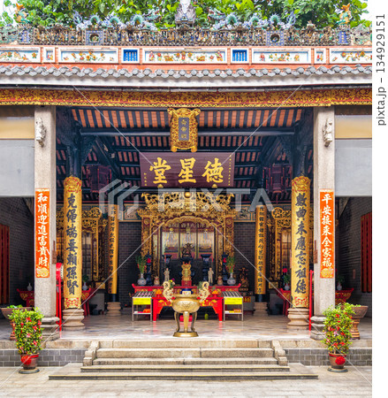 Ornate interior of Chan She Shu Yuen Ancestral Hall with golden altar and traditional Chinese decor, Kuala Lumpur, Malaysia. Ornate interior of Chan She Shu Yuen Ancestral Hall with golden altar and traditional Chinese decor, Kuala Lumpur, Malaysia. 134929151