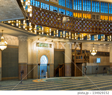 Interior of Masjid Negara National Mosque prayer hall, featuring Islamic architecture and chandeliers, Kuala Lumpur, Malaysia Interior of Masjid Negara National Mosque prayer hall, featuring Islamic architecture and chandeliers, Kuala Lumpur, Malaysia 134929152
