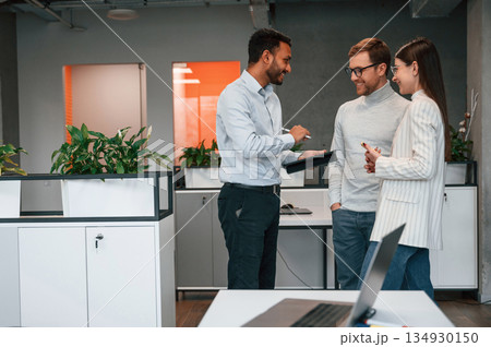 Financial questions. Couple are in the office, getting consulted by a manager Financial questions. Couple are in the office, getting consulted by a manager 134930150