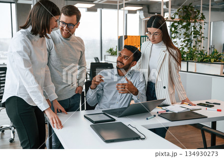 In the office together. Business people in the formal clothes In the office together. Business people in the formal clothes 134930273