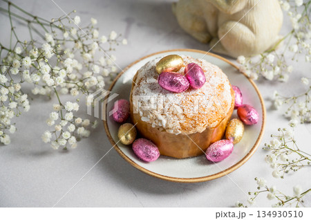 Easter cake with chocolate easter eggs and gypsophila flowers. Spring holidays Easter cake with chocolate easter eggs and gypsophila flowers. Spring holidays 134930510