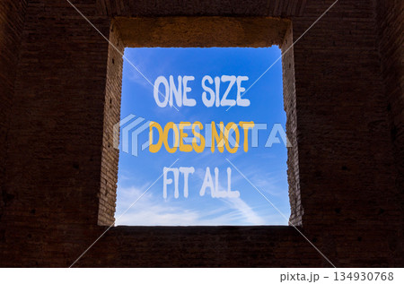 One size does not fit all symbol. Concept words One size does not fit all on beautiful window in brick wall. Beautiful blue sky background. Business one size does not fit all concept. Copy space. One size does not fit all symbol. Concept words One size does not fit all on beautiful window in brick wall. Beautiful blue sky background. Business one size does not fit all concept. Copy space. 134930768