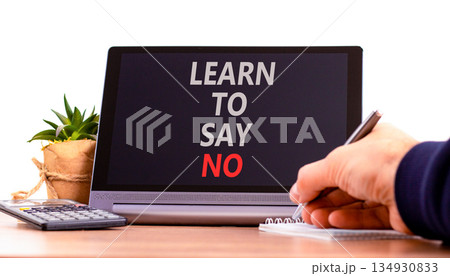 Learn to say no symbol. Concept words phrase Learn to say no on beautiful black tablet. Businessman's hand. Beautiful white background. Business psychological Learn to say no concept. Copy space. Learn to say no symbol. Concept words phrase Learn to say no on beautiful black tablet. Businessman's hand. Beautiful white background. Business psychological Learn to say no concept. Copy space. 134930833