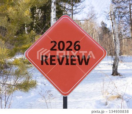 2026 Review symbol. Concept words 2026 Review on beautiful red road sign. Beautiful winter forest background. Business and 2026 review concept. Copy space. 2026 Review symbol. Concept words 2026 Review on beautiful red road sign. Beautiful winter forest background. Business and 2026 review concept. Copy space. 134930838