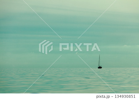 Seascape evening sea horizon and ship on water. Seascape evening sea horizon and ship on water. 134930851