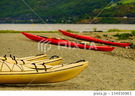 Kayaks on fjord shore, Flam, Norway 134930961