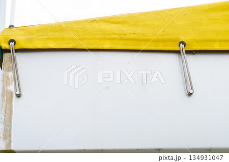 Close up of semi trailer tilt, tarpaulin. Close up of semi trailer tilt, tarpaulin. 134931047