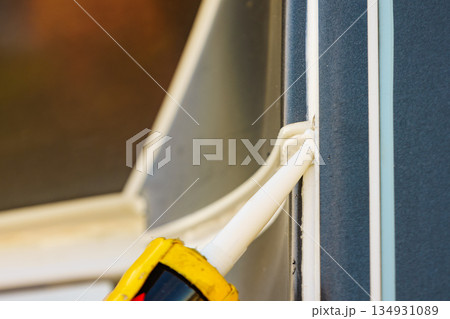 Applying silicon on caravan body Applying silicon on caravan body 134931089