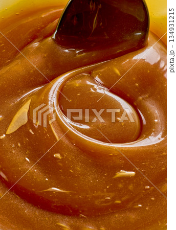 freshly cooked homemade caramel sauce background freshly cooked homemade caramel sauce background 134931215