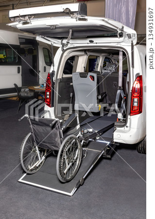 Innovative wheelchair-accessible van with a sleek ramp for smooth mobility. Innovative wheelchair-accessible van with a sleek ramp for smooth mobility. 134931697