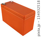 Reliable lead-acid battery in a gray plastic case with red terminals. On a white background 134932518