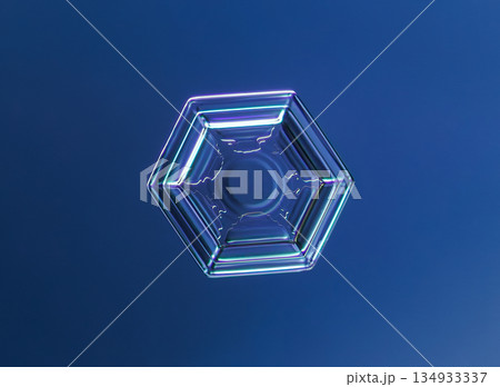 Natural snowflake crystal in blue background Natural snowflake crystal in blue background 134933337