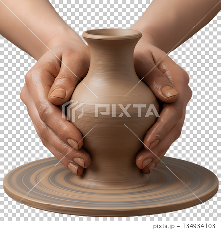 Close-up of a potter's hands shaping wet clay on a spinning pottery wheel, showing the creative process and craftsmanship 134934103