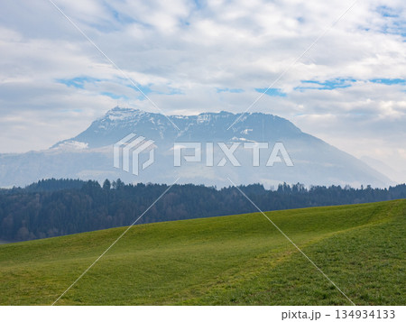 Rigi, Switzerland - February 9th 2025: View from a green field towards mount Rigi, a famous peak in Switzerland, Europe 134934133