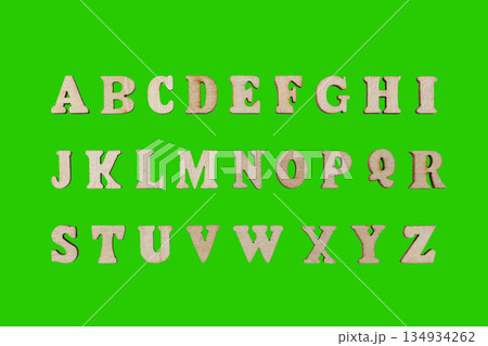 wooden letters of the English alphabet on a green background 134934262