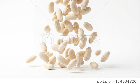 Dry white beans falling on white background 134934820