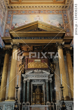 Archbasilica of Saint John Lateran interior Rome golden coffered ceiling marble columns statues ornate chapels baptistery and apse Catholic basilica Italy. High quality photo Archbasilica of Saint John Lateran interior Rome golden coffered ceiling marble columns statues ornate chapels baptistery and apse Catholic basilica Italy. High quality photo 134936143